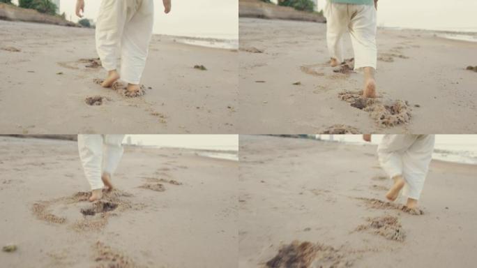 快乐的小男孩在沙滩上奔跑