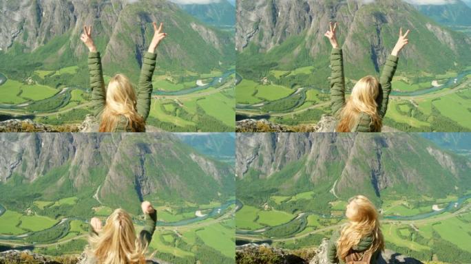 4k视频片段，一个无法识别的女人在Romsdalen周围徒步旅行时欣赏山景