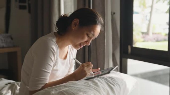 艺术家女性在数字平板电脑上绘画