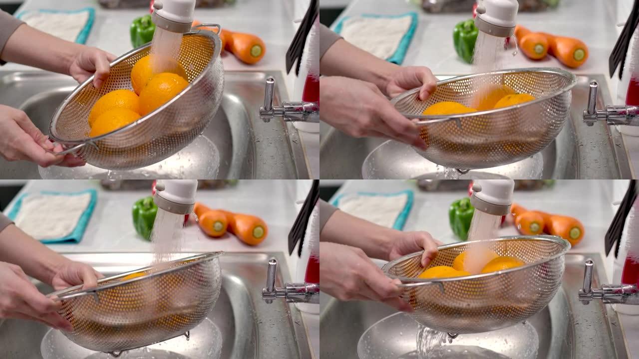 特写手洗橙色水果特写展示食物食品食材美食