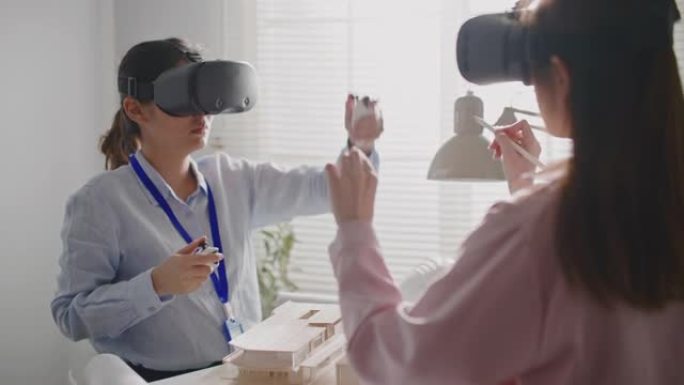 建筑师团队佩戴增强现实耳机工作VR技术