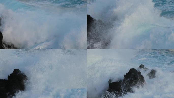 海浪撞击岩石的慢动作镜头。带有白色泡沫的大风暴。UHD 4K