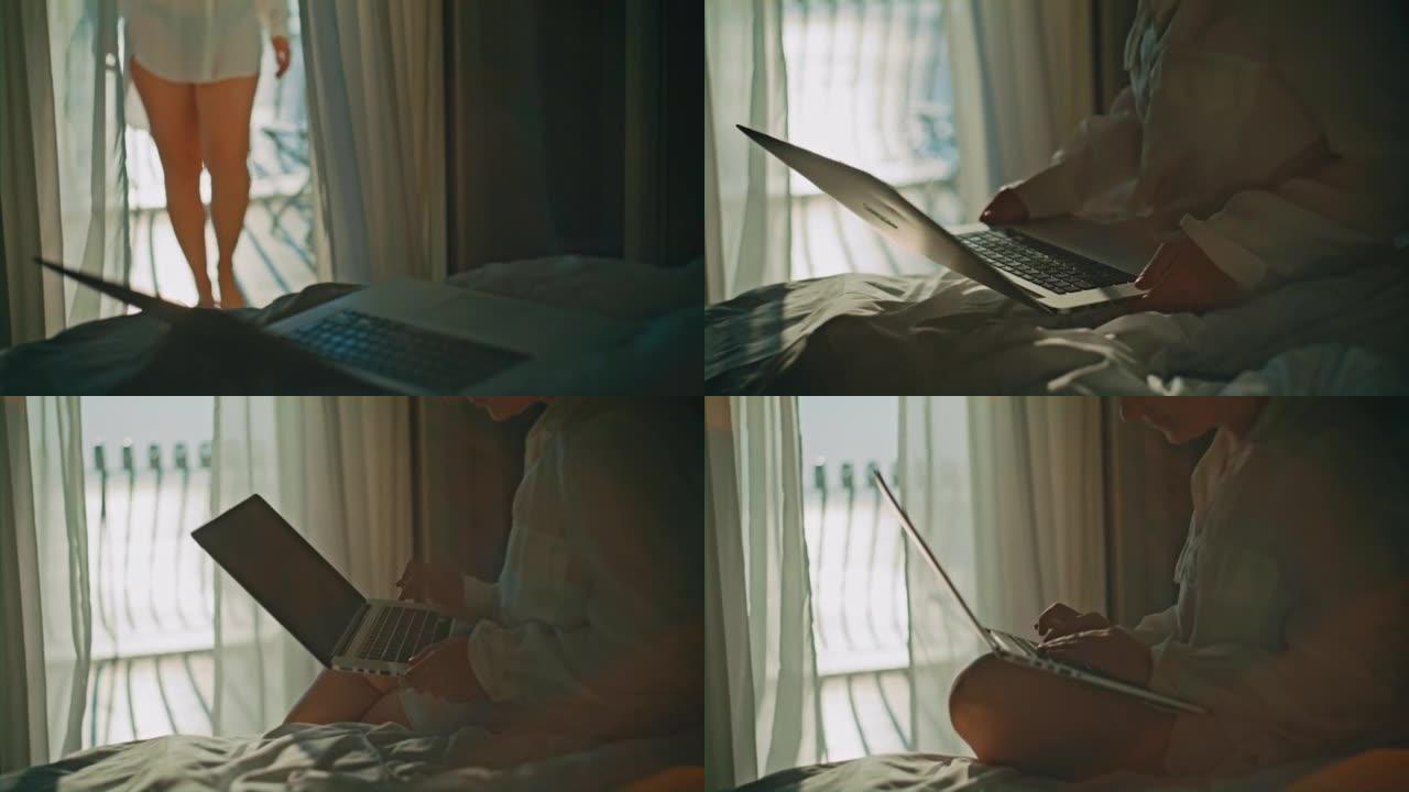 金发女人从她房间的酒店阳台上走，坐在床上，开始在笔记本电脑上工作