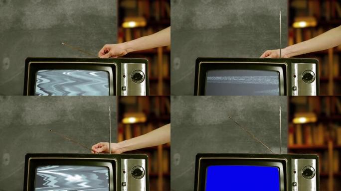 用手调节带有蓝屏的旧电视的天线。4K。