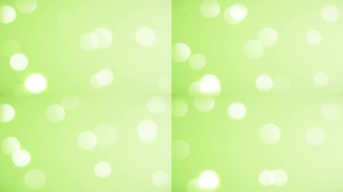 柔和的绿色背景 (可循环)。抽象模糊圆美丽的bokeh运动设计。名人，闪亮，新年快乐，活动，情人节，