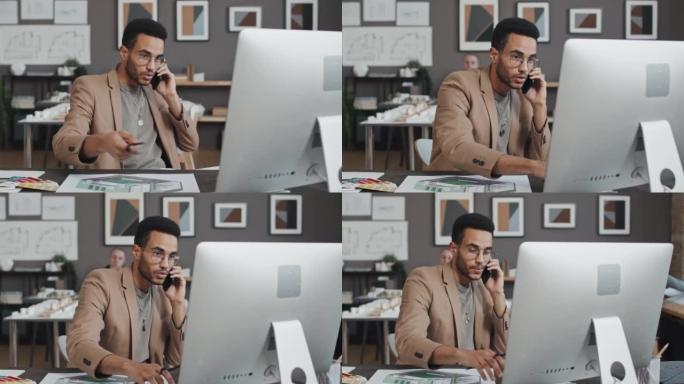 混血儿设计师在手机上聊天