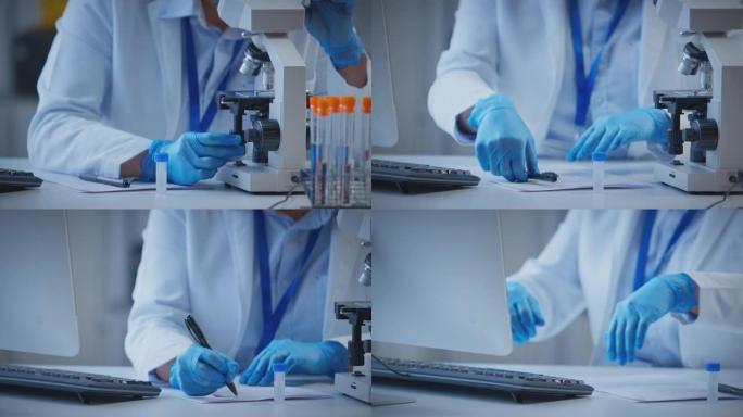 实验室工作人员通过显微镜观察并在电脑上记录测试结果的特写