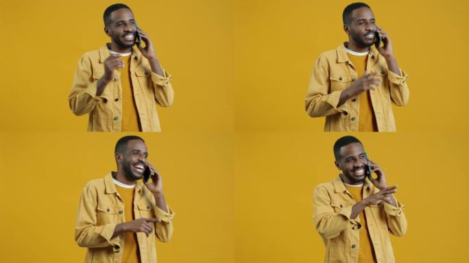 无忧无虑的非洲裔美国人在手机上聊天享受友好交谈的肖像