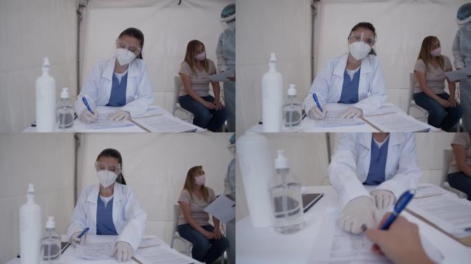 患者进入新型冠状病毒肺炎帐篷测试，女医生一边看相机一边解释一切