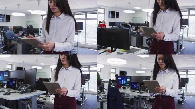 女人在办公室使用数字平板电脑