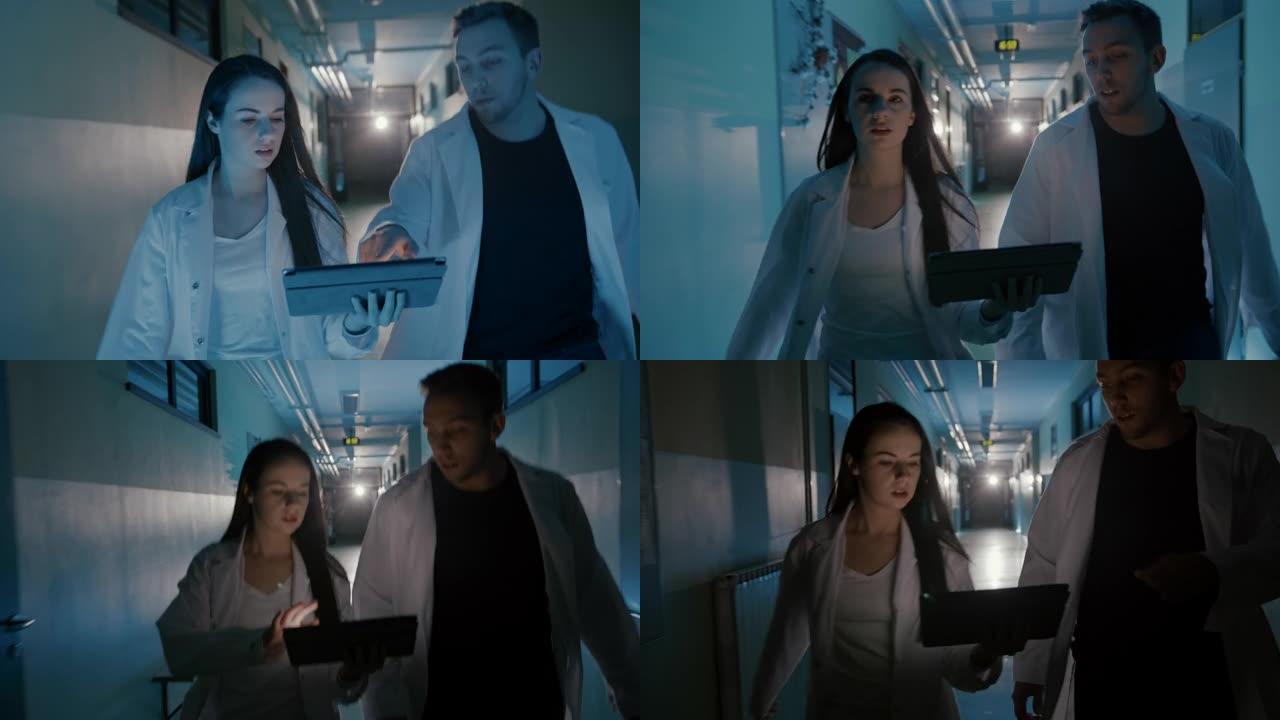 SLO MO两名ER医生在冲下医院走廊时使用数字平板电脑