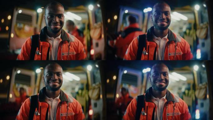 一名黑人非洲裔美国EMS护理人员的肖像自豪地站在镜头前，穿着高可见度的医用橙色制服，面带微笑。成功的