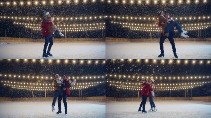 浪漫的冬天下雪的夜晚: 滑冰夫妇在溜冰场上玩得开心。双人滑冰boyfried抬起他美丽的女友并旋转。