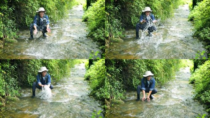 徒步旅行者在山间溪流中抽水