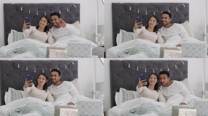 一对年轻夫妇在家里的视频通话中一起躺在床上的4k视频录像