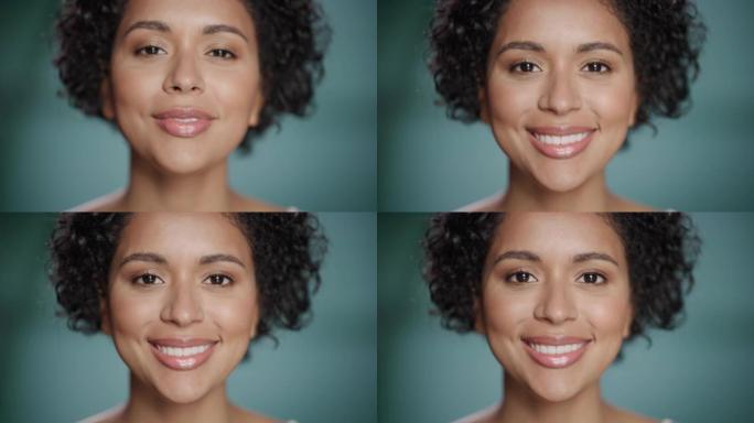 特写女性美女肖像。快乐的多民族黑人女性，自然健康的皮肤，卷曲的非洲头发摆姿势，微笑。柔软孤立背景下的
