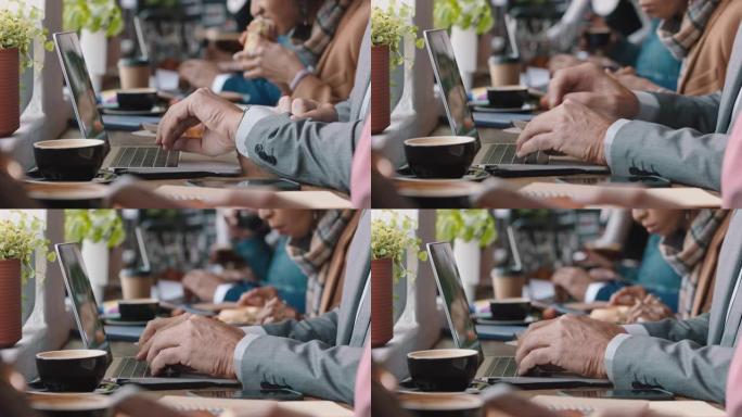 多元化的商人在繁忙的咖啡馆里使用笔记本电脑，忙碌的活动在线浏览共享数字电子邮件通信