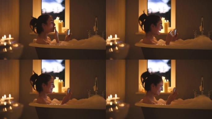 4k视频拍摄了一名年轻女子在泡泡浴中的视频通话中吹吻的镜头