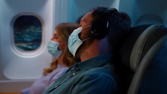 在飞机上睡觉经济舱商务舱坐飞机商务人士