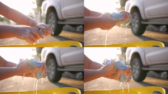 手慢动作，带洗车液的汽车毛巾，用于洗车