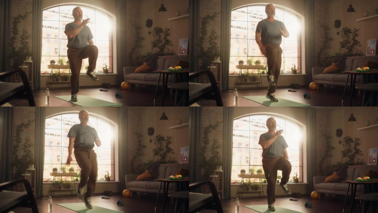 强壮的运动健康的高级男子在阳光明媚的公寓在家晨练时做有氧高膝盖和核心强化练习。健康的生活方式、健身、