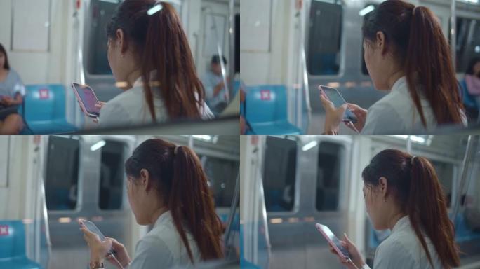 在乘坐地铁时使用智能手机的女人，特写镜头