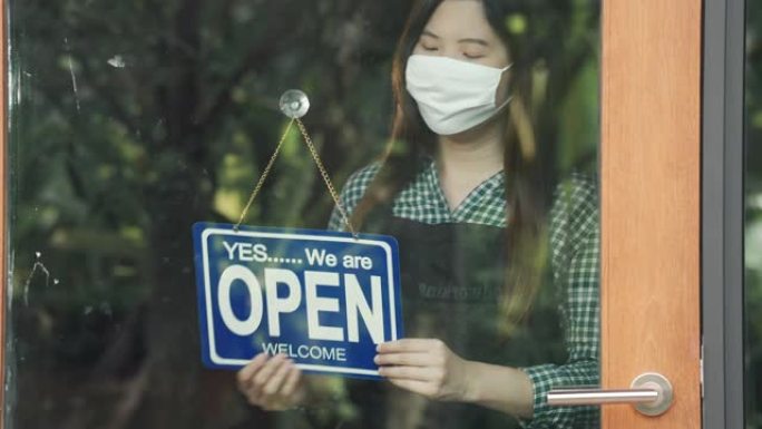 亚洲女店主在新型冠状病毒肺炎期间被封锁后重新开店