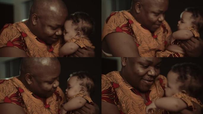 非洲父亲携带新生婴儿