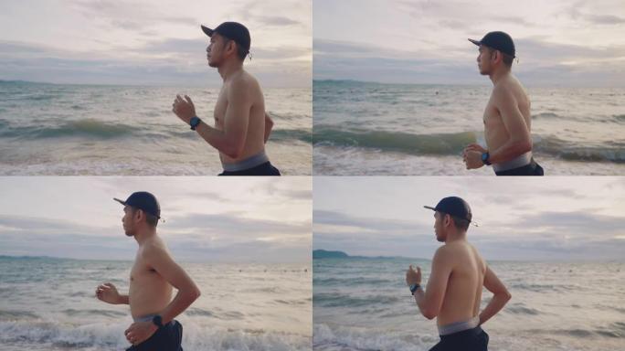 在海滩上跑步的亚洲男性。