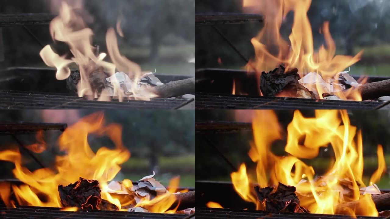 用火在烧烤架上燃烧的纸。特写。放大。黑白到彩色。