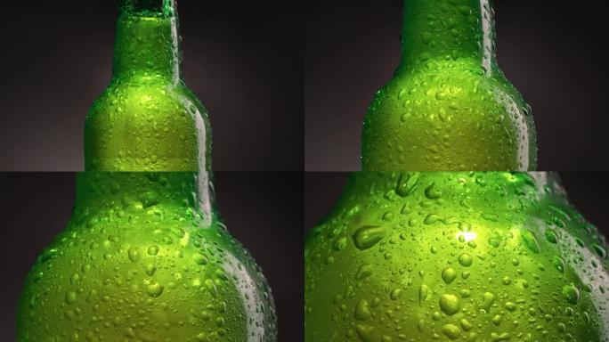 绿色冷瓶，配有啤酒、水或软饮料。装有水滴和冷凝水的瓶子。冷光精酿啤酒。镜头中的旋转缩放