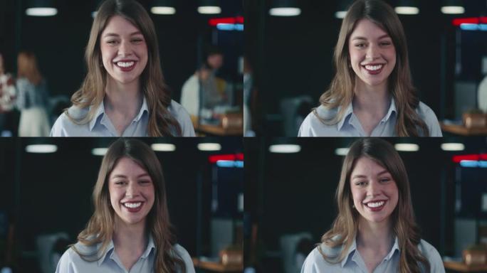 快乐美丽的年轻女商人，企业家欢快地微笑，在繁忙的办公室背景下嘲笑镜头。