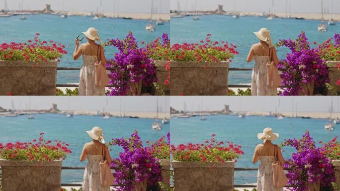 一个穿着夏装的女人在意大利港口的景色。