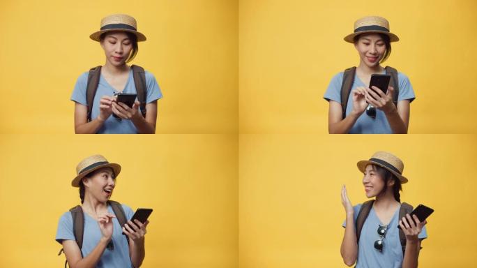 快乐青春美丽的亚洲女人戴帽子背包拿着智能手机享受预订旅行酒店和机票预订。