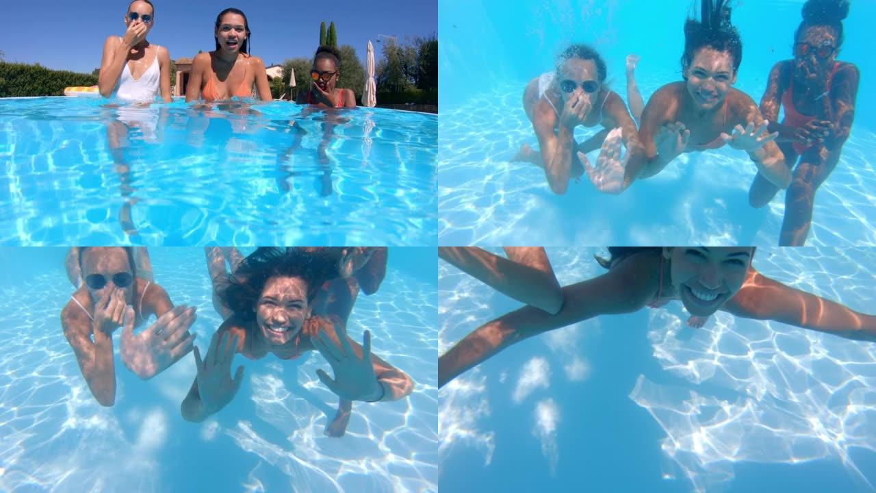 穿着比基尼的年轻多民族女友的水下镜头很有趣，可以在游泳池里享受夏天，并在镜头前微笑。