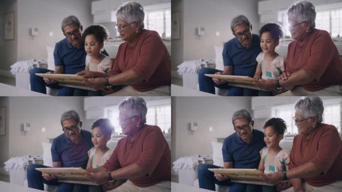 祖父母和孙女坐在家里参观时看着照片、照片和回忆。老年夫妇和他们的孙女在一起度过时光，并成为一个家庭。