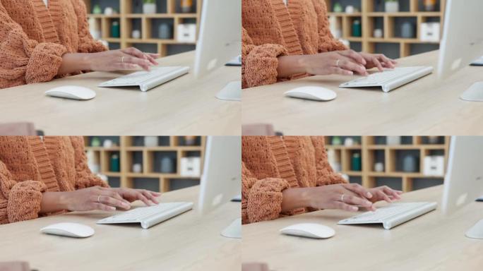 女人坐在办公桌前并在现代办公室发送电子邮件时，双手在键盘上打字的特写镜头。记者为一篇文章做在线研究。