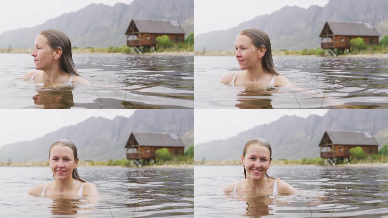 白人妇女在山上旅行时玩得很开心，穿着泳衣和游泳