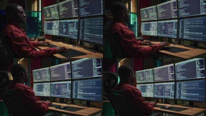黑色网络安全专家在台式计算机上编码，在黑暗的办公室中有六台显示器。国防部私营部门的非裔美国男性承包商