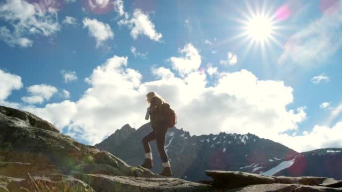 4k视频片段，一个无法识别的女人徒步穿越m ø re og Romsdal的山脉