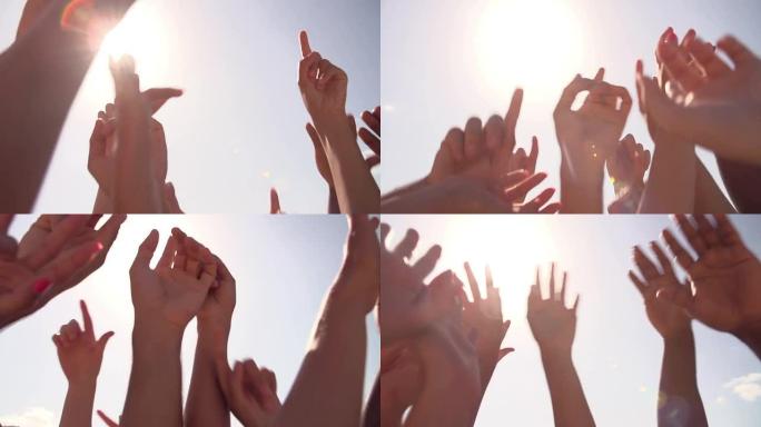 舞者的双手对着天空的慢动作序列
