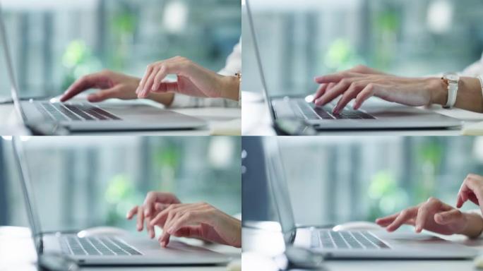 一名女商人在现代办公室使用笔记本电脑的4k视频片段