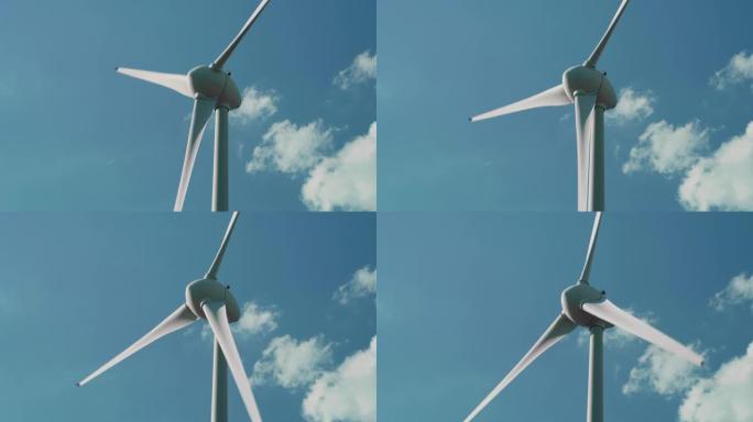 为地球的利益旋转和产生绿色生态能源的风力涡轮机的特写镜头。生产清洁可再生能源的风车。背景与晴朗的蓝色