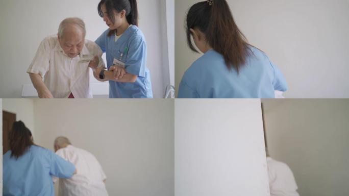 护士帮助老人站立关怀视频素材老人