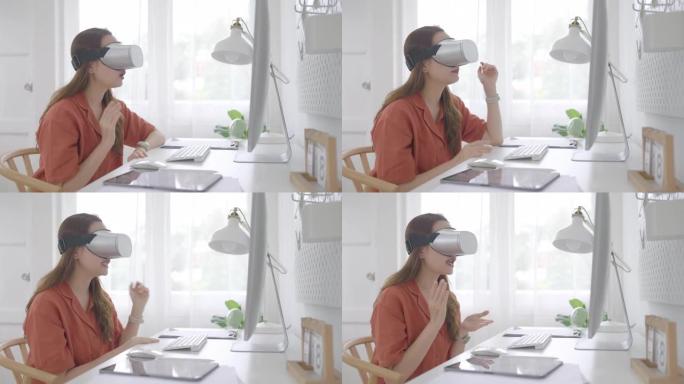美丽的亚洲年轻女商人年龄36岁坐在家庭办公室，戴着虚拟现实护目镜和电脑远程工作在线会议。成人在线学习