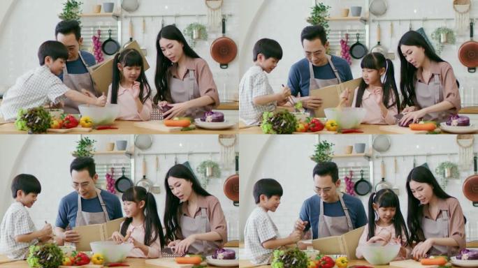 健康的家庭通过学习烹饪素食享受休闲时光。
