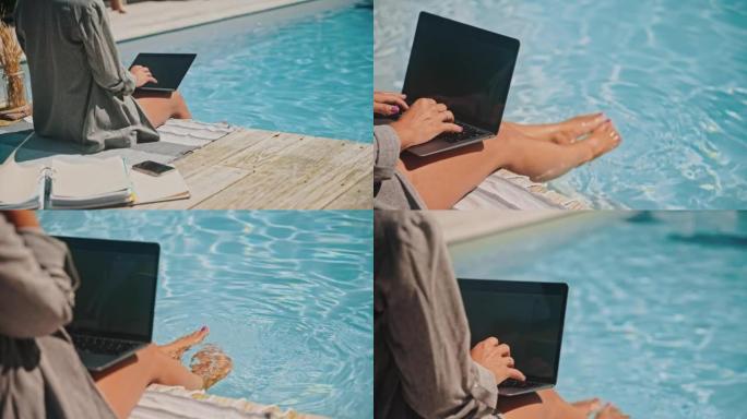 年轻女子在游泳池旁的笔记本电脑上工作时打来电话