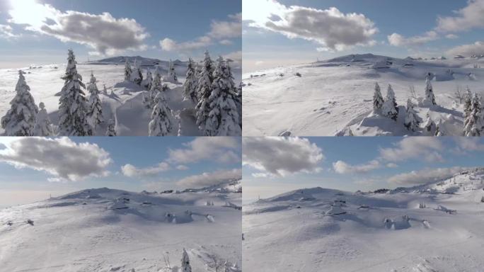 无人机: 白雪覆盖的山脉和Velika Planina的小屋的空中拍摄