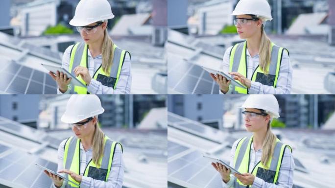 一名年轻女子在建筑物的屋顶上安装太阳能电池板时使用数字平板电脑。一名妇女在网上从事可再生能源建筑项目