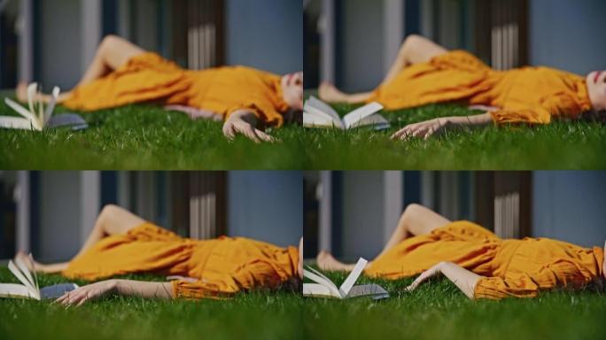 SLO MO年轻女子躺在草地上享受阳光